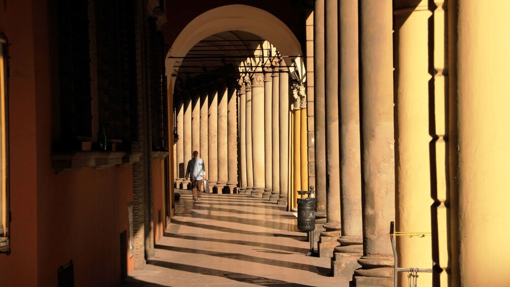Man walks through hall of Bologna