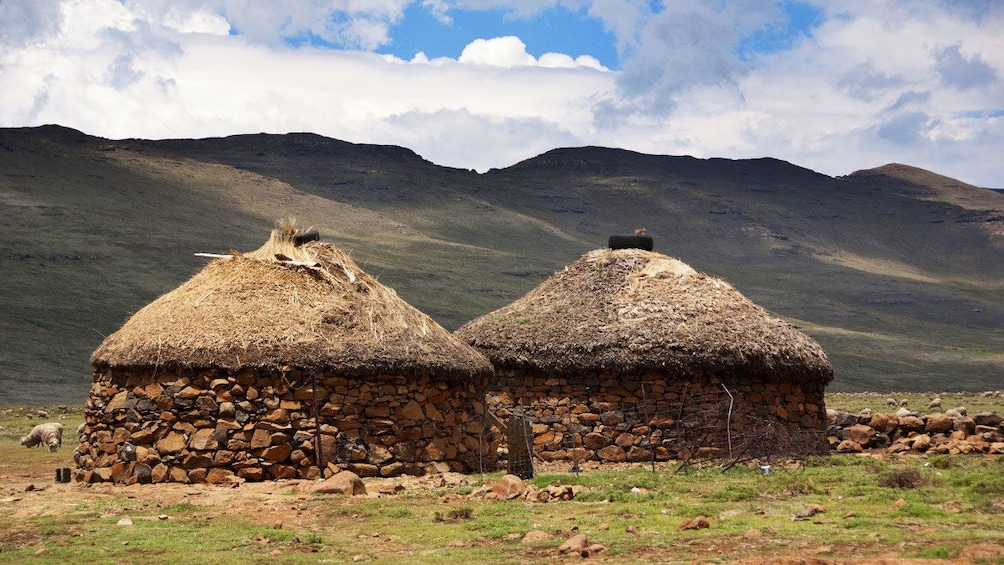 Traditional round stone and thatched roof houses in Lesotho