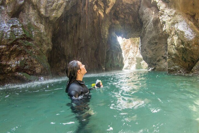 Make your way through the canyon in a warm wetsuit