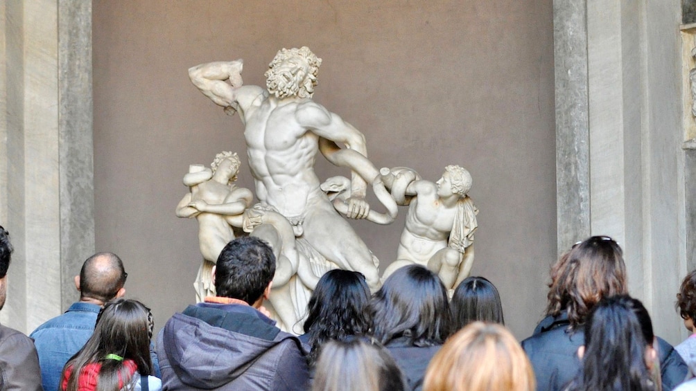 Tour group looking at sculpture at the Vatican in Rome