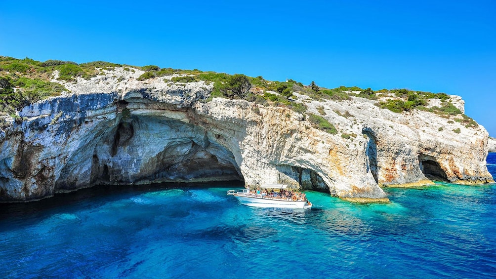 Boat exploring the Blue Caves in the Ionian Islands