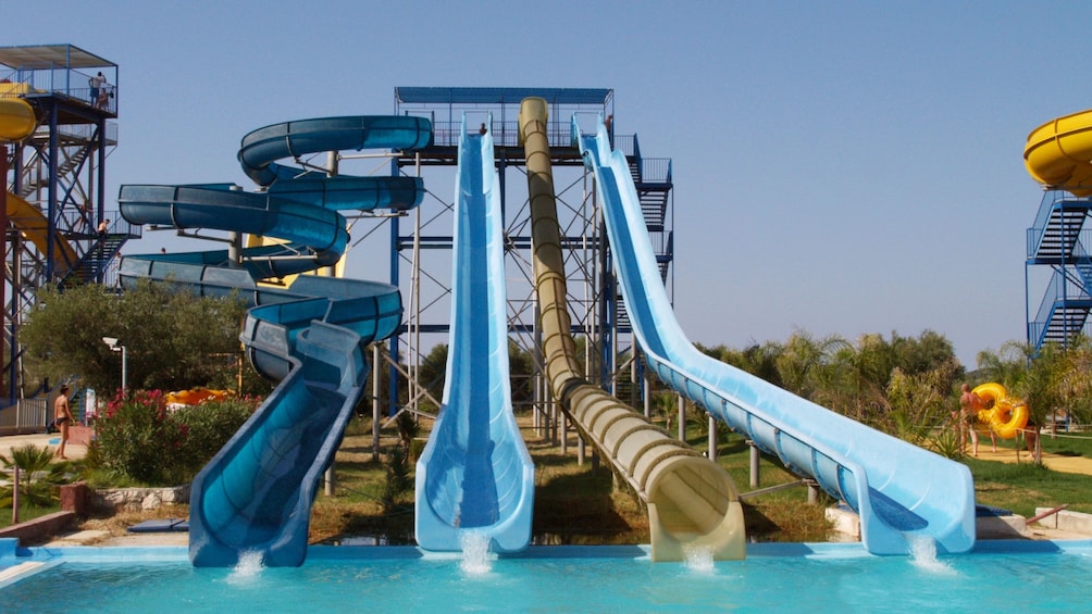 Four tall water slides at water park on Ionian Islands