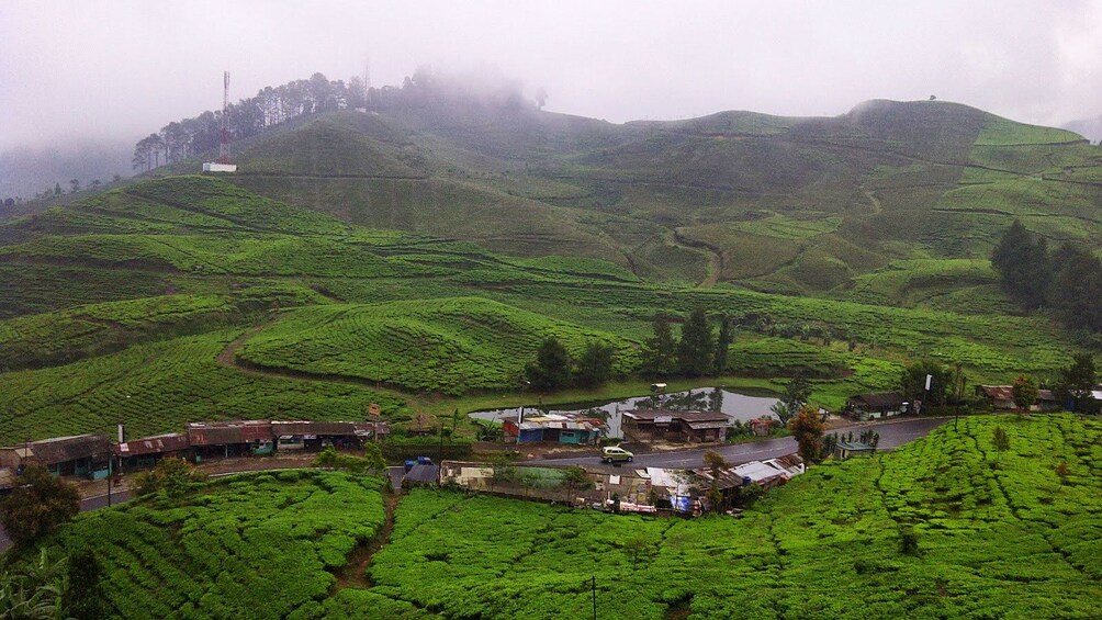 Small shops and homes along road in Punchak Highlands in Indonesia