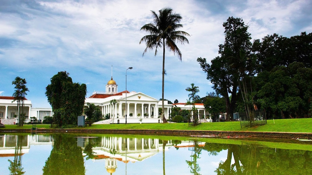 View of Bogor Palace from across pond in Indonesia
