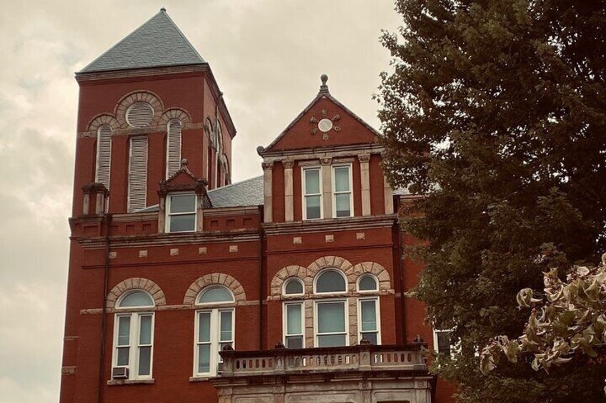 The four house looms large and hides suspicious deaths and stands on the grounds of a Civil War camp. 