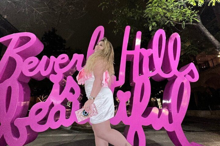Take photos in front of the pink Beverly Hills sign 