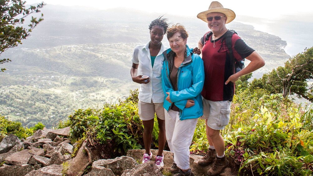 Trio poses for photo at overlook at Gros Piton