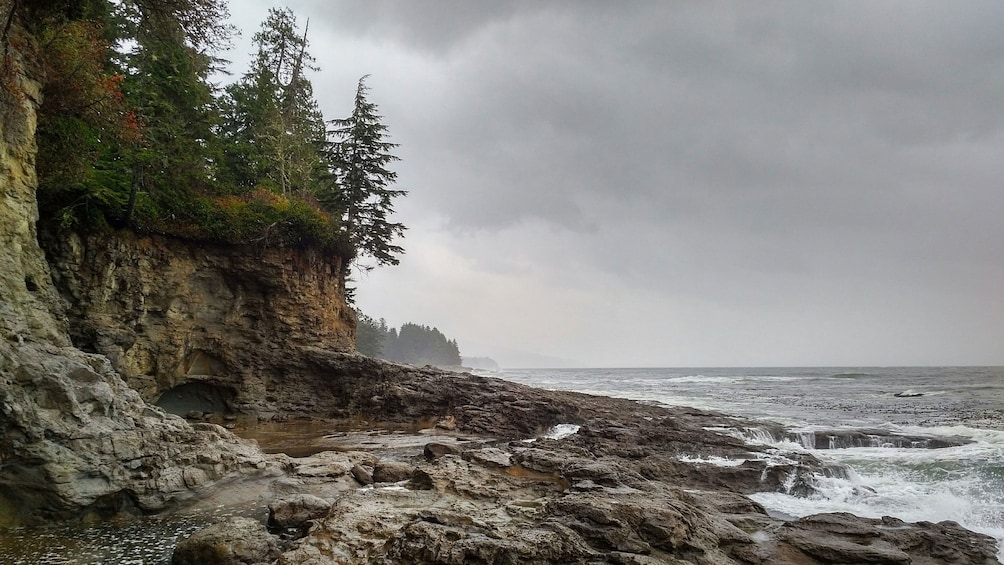 Rocky beach with cliffs as storm approaches in Port Renfrew