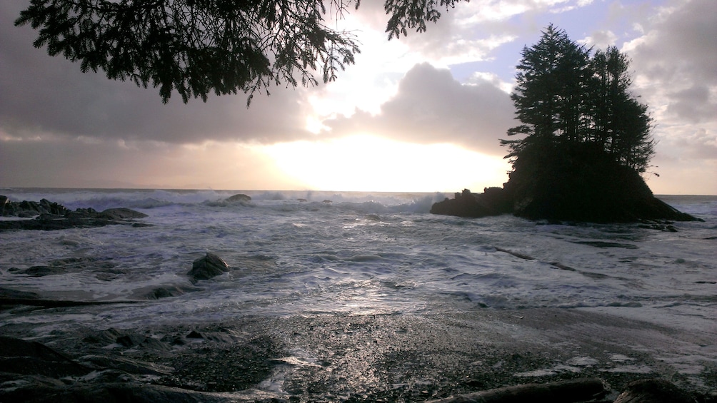 Tide comes in as the sun sets on Port Renfrew