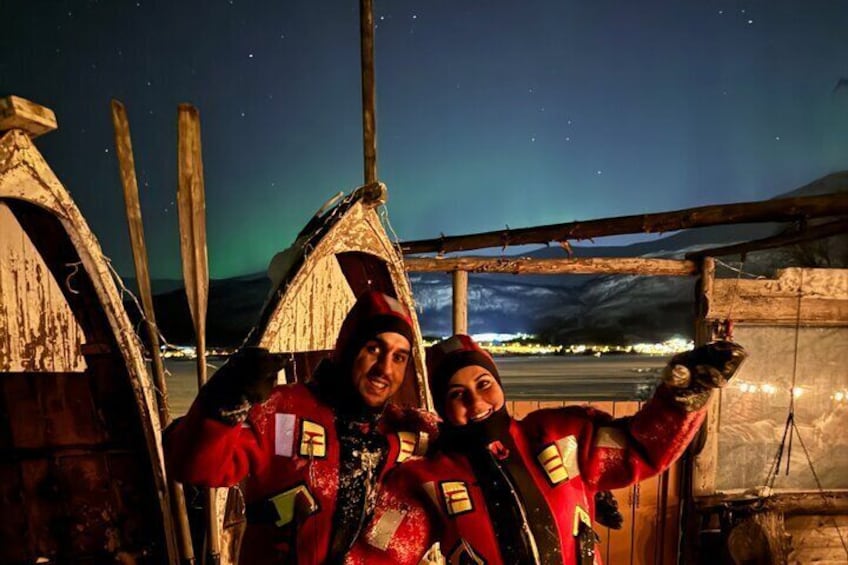 Two happy floaters beneath the Northern Lights