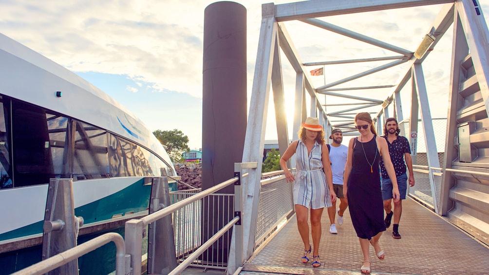 Group walks on to a cruise boat