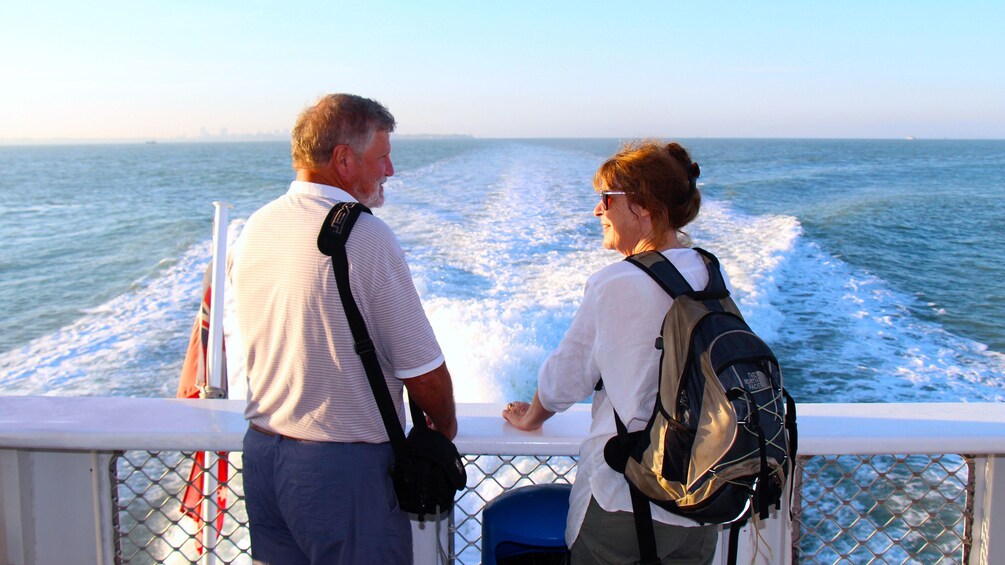 Couple standing to back of ferry to Crab Claw Island