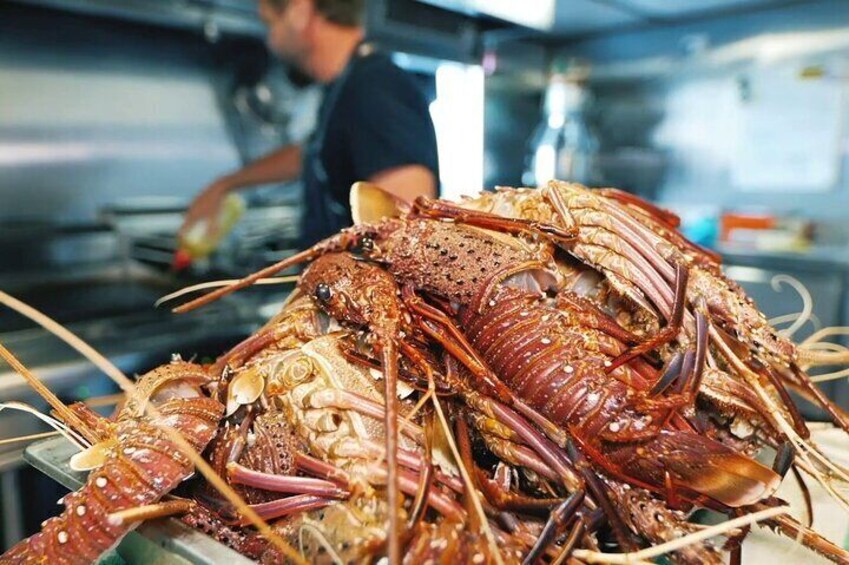 On-board Chef preparing a crayfish meal
