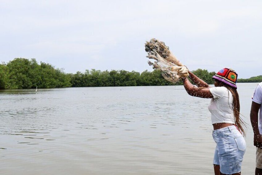 Typical lunch on the beach, mangrove ecotour and fishing with natives