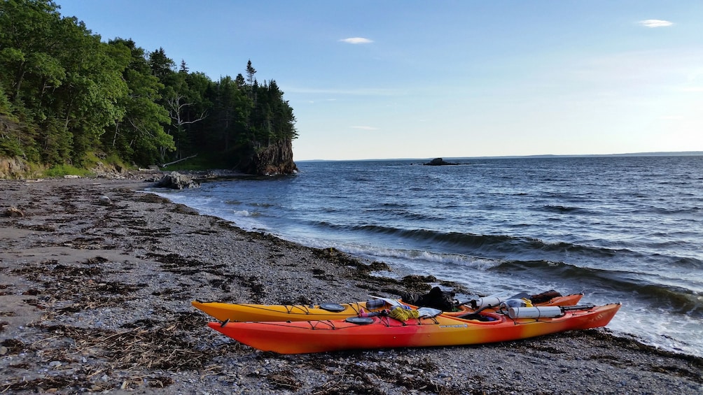 Pair of kayaks on shore at Casco Bay