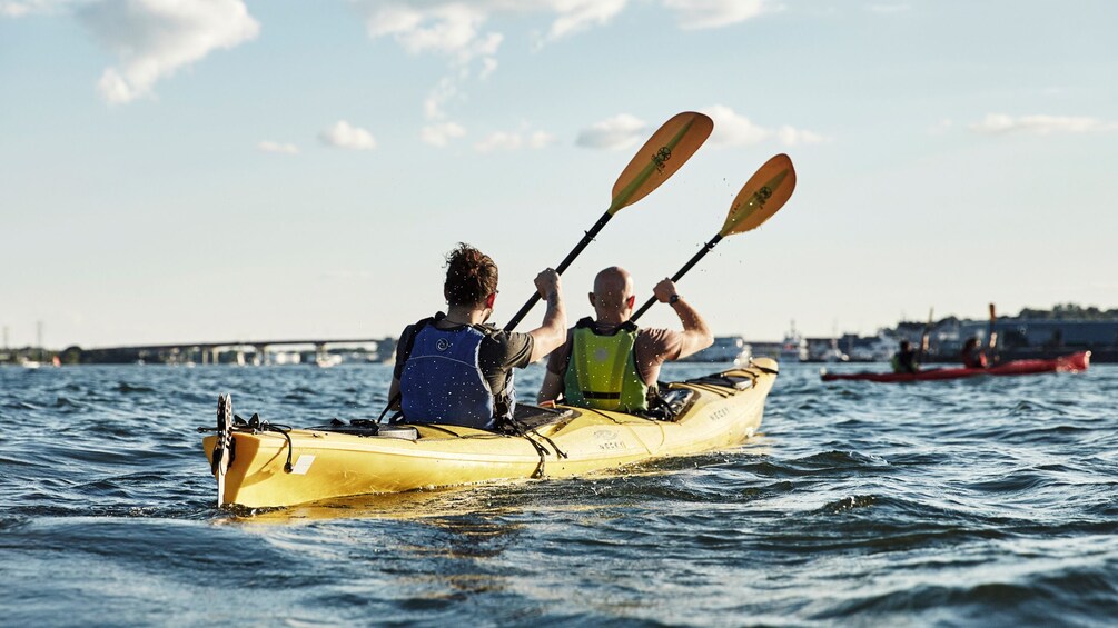 Couple in a tandem kayak in Casco By