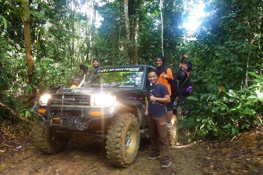 Thrilling Off-Road Expedition: Conquer mudholes, rainforests, and river crossings in rugged trucks.