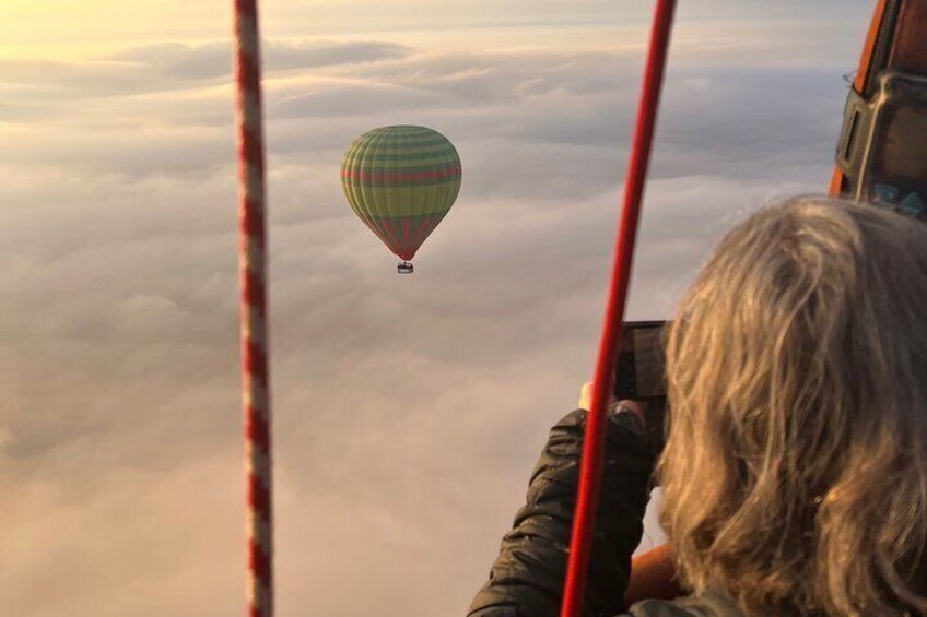 Hot air balloon flight in the desert with camel ride