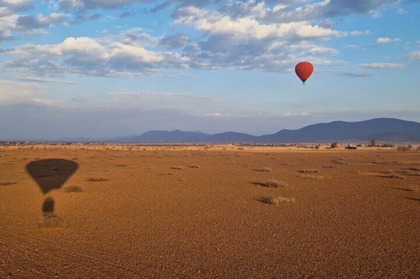 Hot air balloon flight in the desert with camel ride