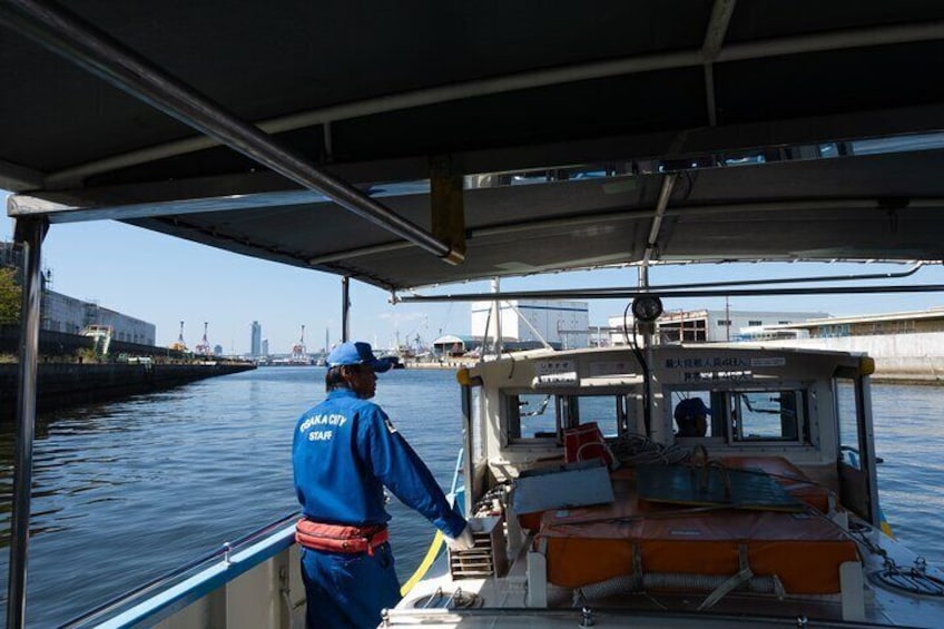 Crossing the canal on a ferry operated by Osaka City.