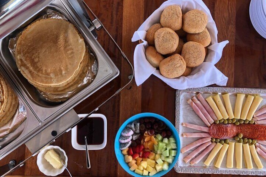 Dutch pancakes, sandwiches, fruit, yoghurt and muesli 