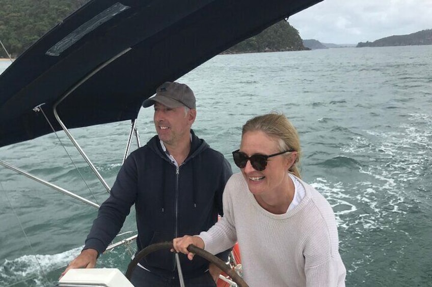 Girl steering a yacht