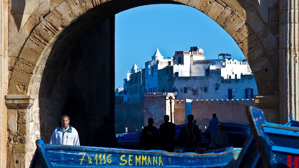 View of city in background with boats in Essaouira