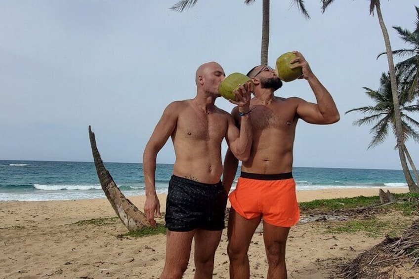 Drinking coconuts freshly picked from the palm tree.