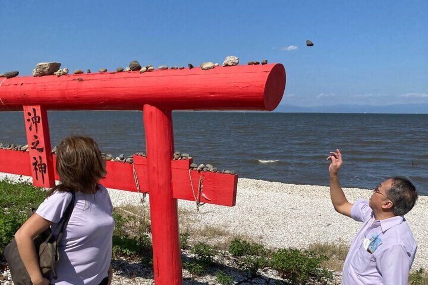 Try your luck getting the stone on the top of the Torii gate.
