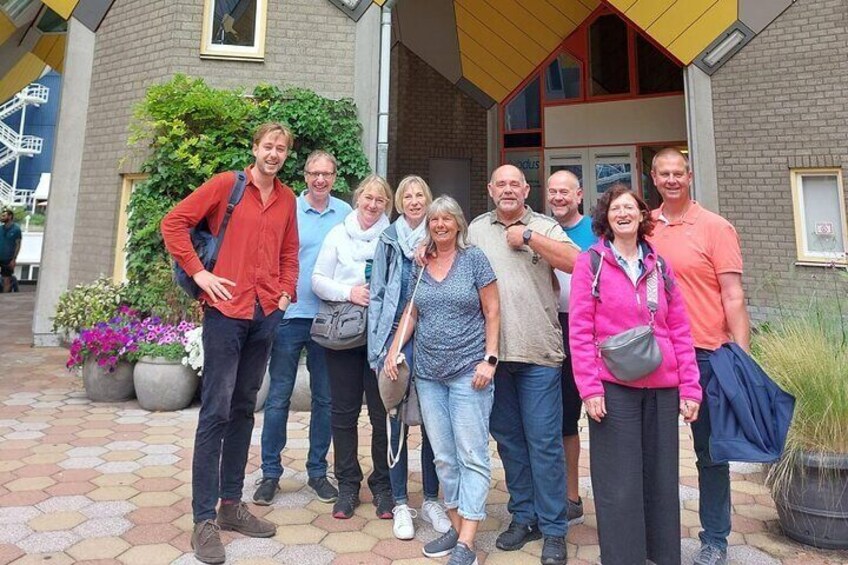 Guide with group under the cubic houses