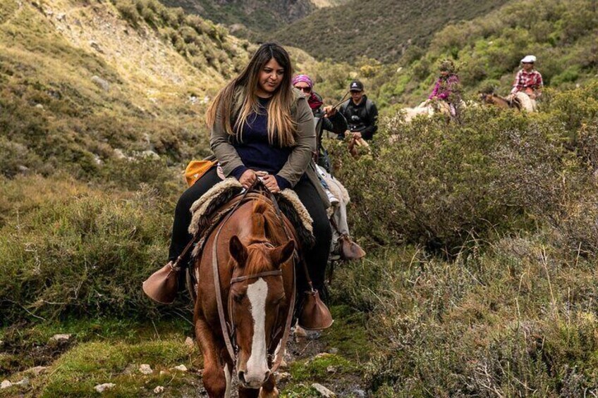 Horseback riding at sunset in the Andes