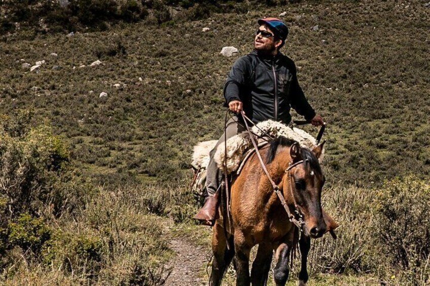 Horseback riding at sunset in the Andes