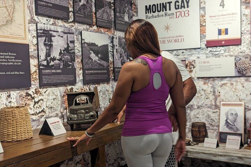 Guests looking at the replicated models in the Mount Gay Rum History Museum 