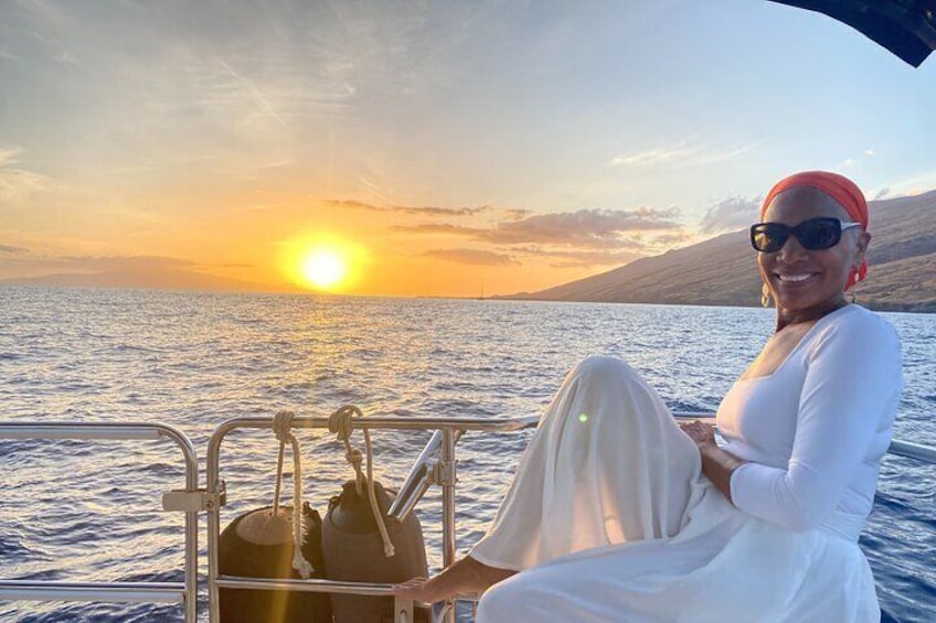 Sunset smiles when on your private charter sailboat in Maui