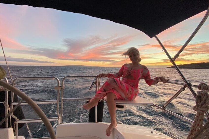 When your outfit matches the sunset on your private charter sailing boat in Maui