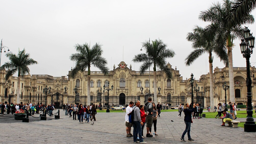 Show item 1 of 5. People stand outside of the Convent of Santo Domingo in Lima