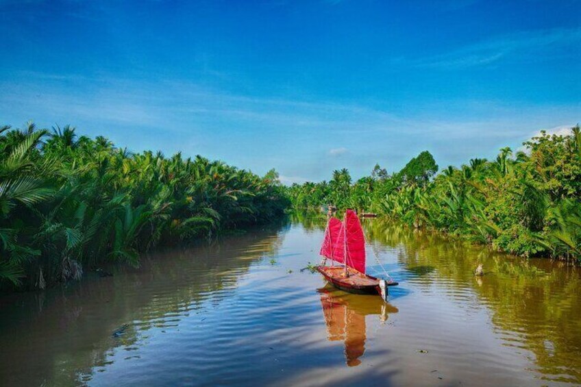 Dive into a serene world of coconut trees aboard a sailboat, far from the tourist crowds.