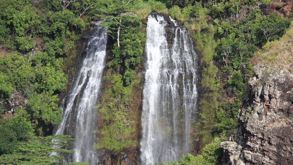 waterfall down side of cliff in Kauai