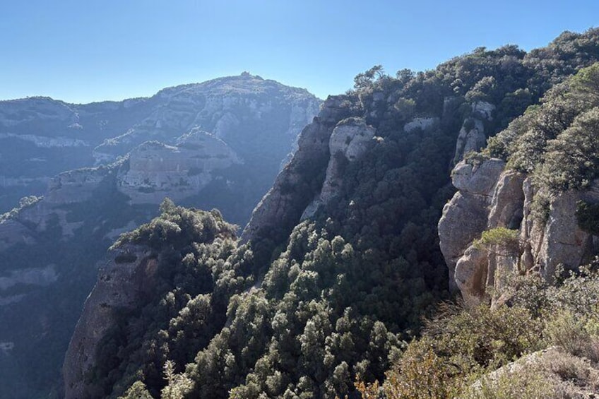 From Barcelona: Hiking in the mountain with caves, cliffs