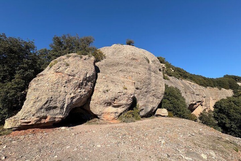 From Barcelona: Hiking in the mountain with caves, cliffs