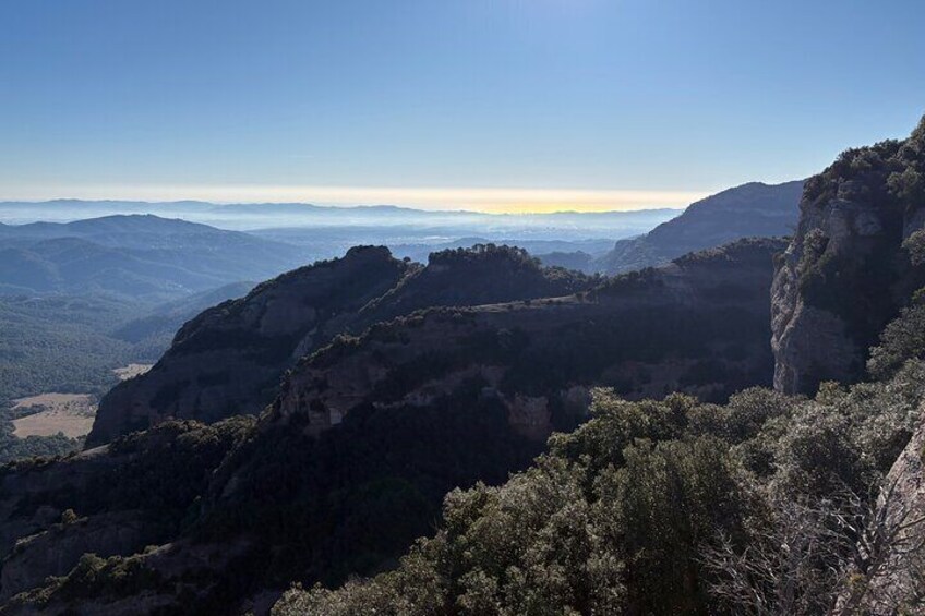 From Barcelona: Hiking in the mountain with caves, cliffs