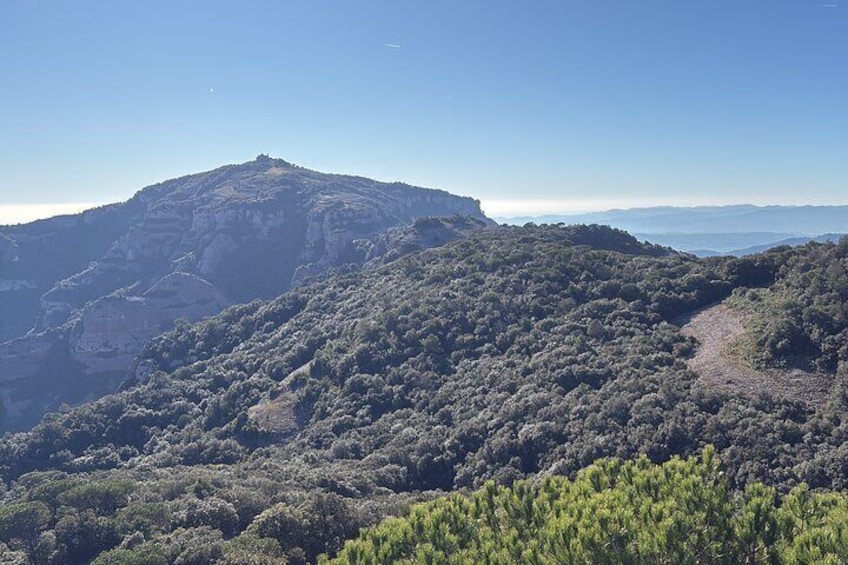 From Barcelona: Hiking in the mountain with caves, cliffs