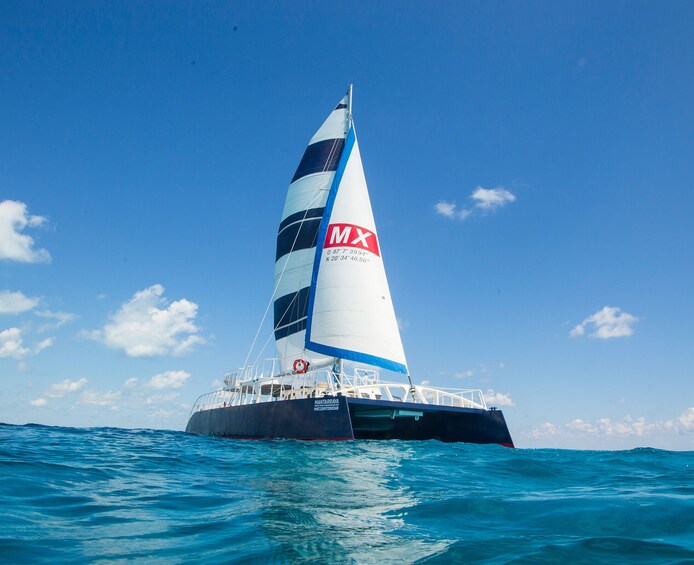 Catamaran Tour to Isla Mujeres Snorkel Buffet Private Beach Club by XCARET