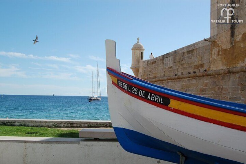 Sesimbra traditional boat near the Fortress of Santiago
