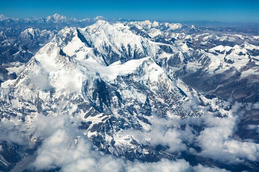 The Himalayan range as seen from the window of an aircraft during mountain flight