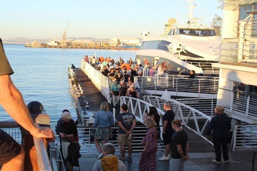 Travelers boarding the ferry to Robben Island at the Nelson Mandela Gateway to Robben Island. 