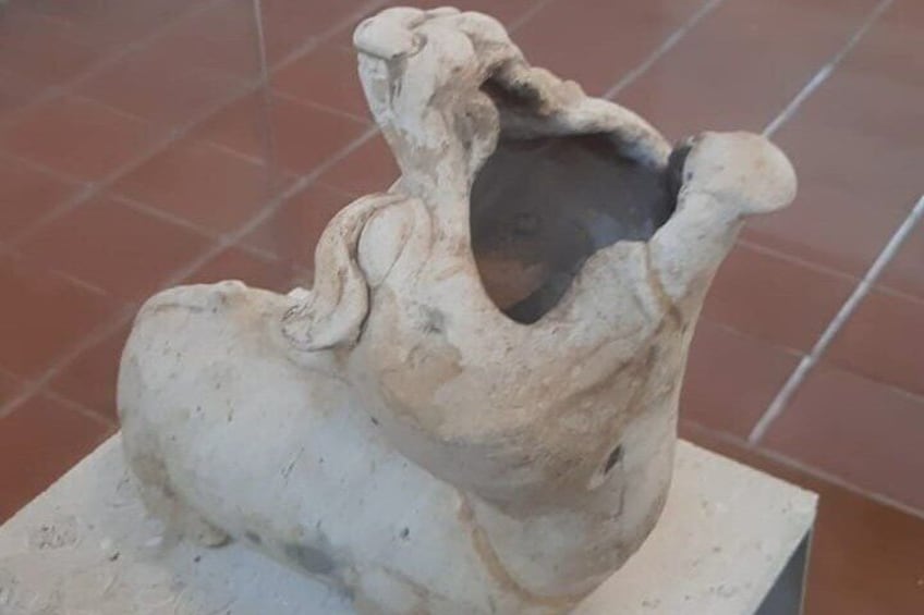 Zoomorphic Figurine: Represents a feline with fantastic features that could have functioned as a smoker.