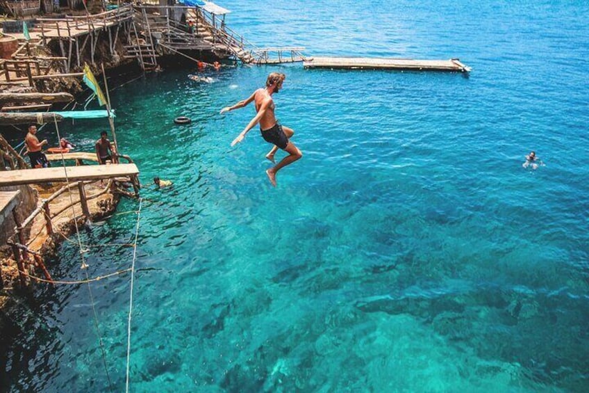 Cliff jump from different heights and plunge into the clear waters of Boracay