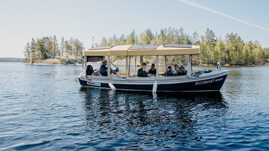 Skipper playing accordion in a fantastic lake scenery