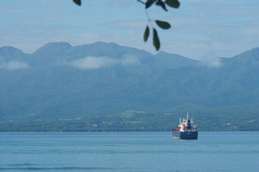 View of the La Soufrière volcano (left)